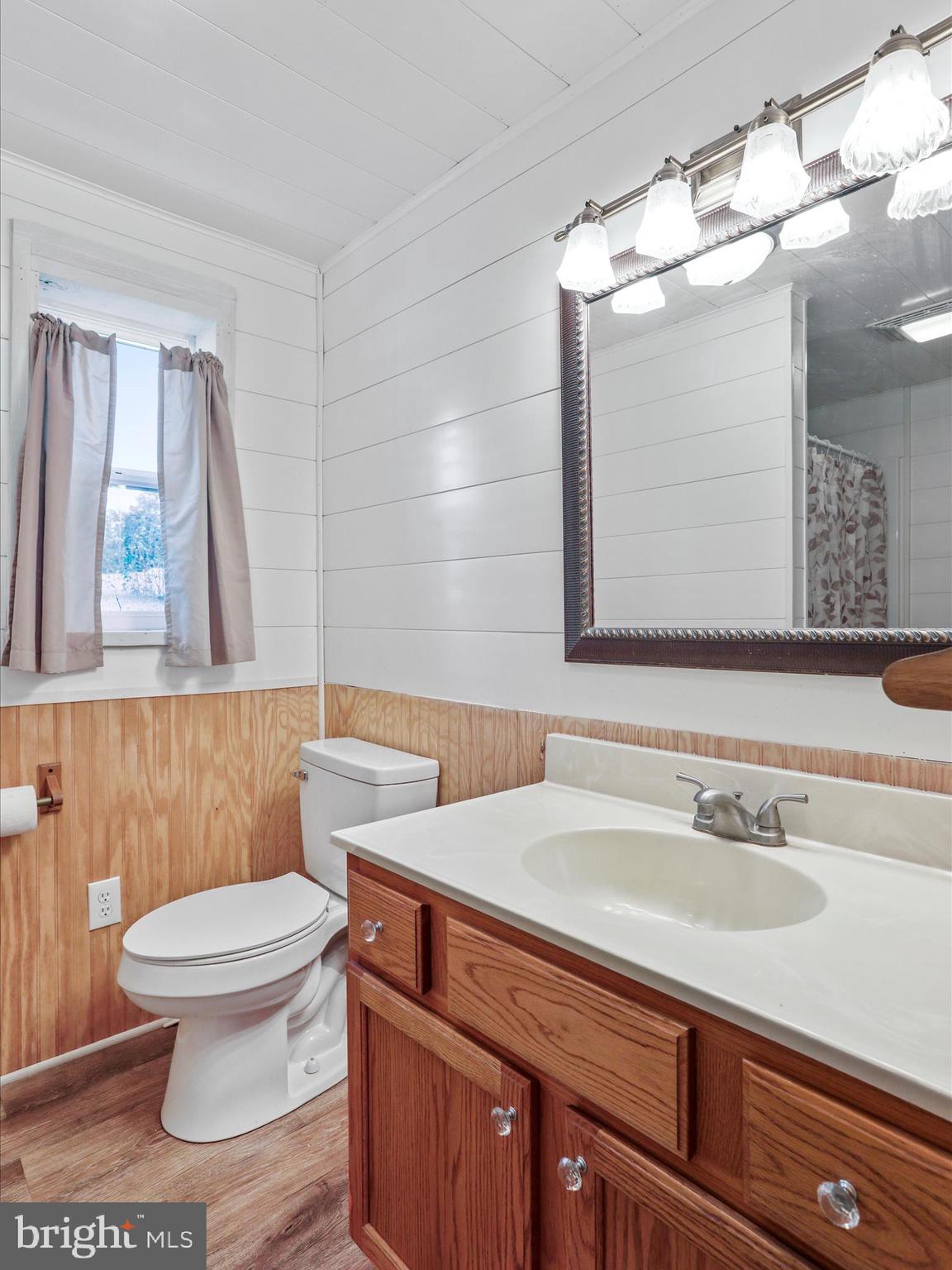 25411 Cascade Road Cascade, MD 21719 - Photo 13 of 53 a bathroom with a sink a toilet and a mirror
