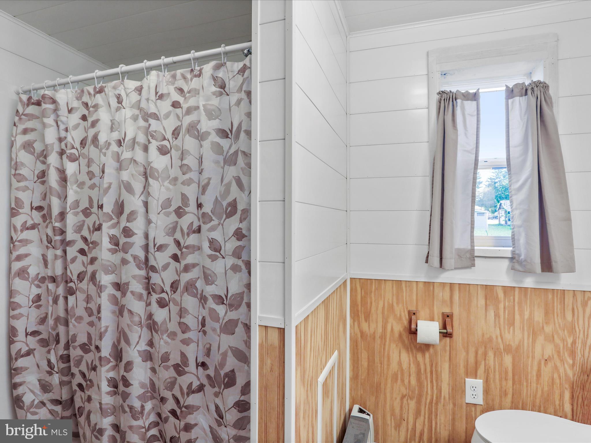 25411 Cascade Road Cascade, MD 21719 - Photo 14 of 53 a bathroom with a shower curtain