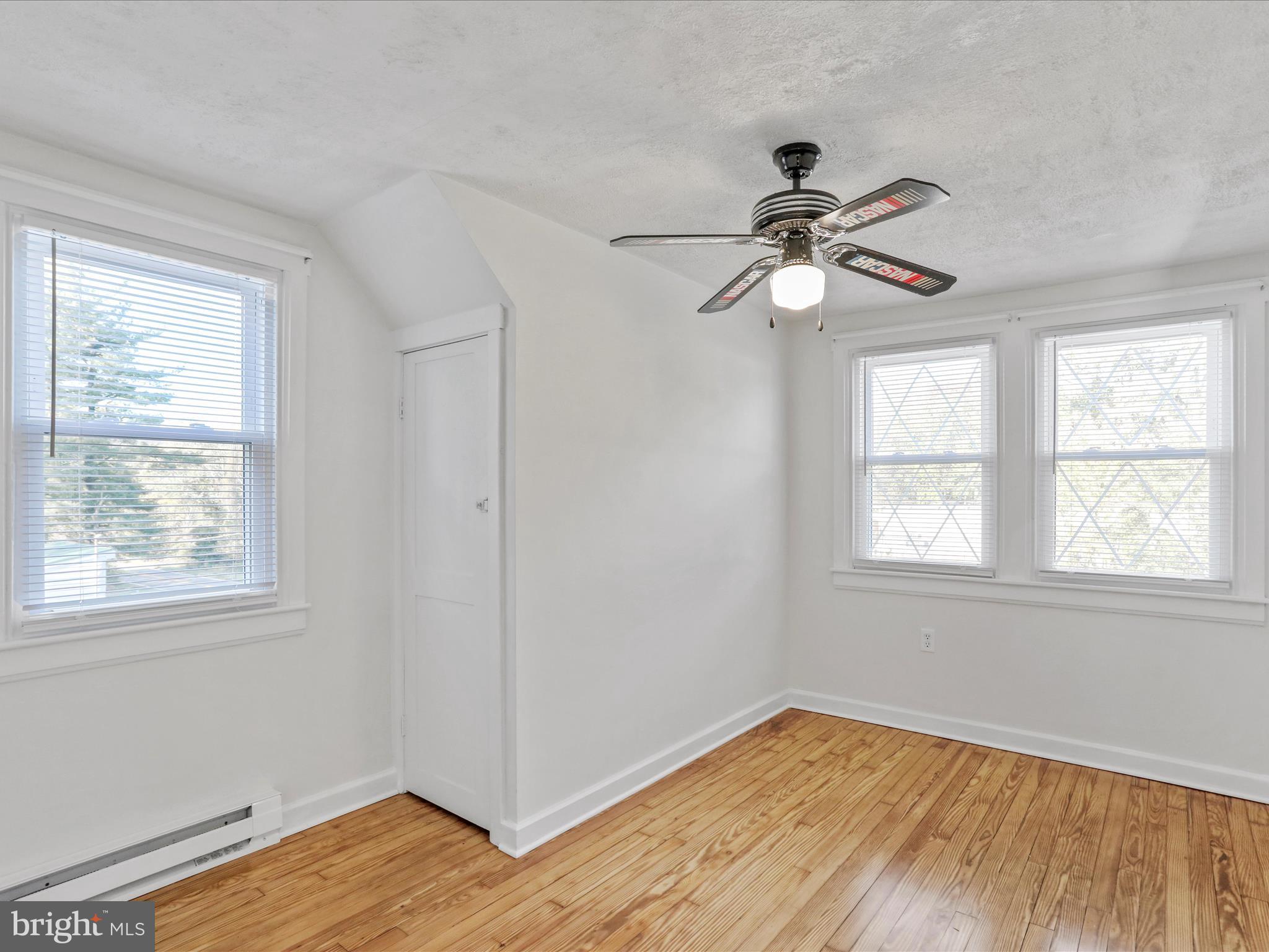 25411 Cascade Road Cascade, MD 21719 - Photo 24 of 53 a view of an empty room with wooden floor and a window