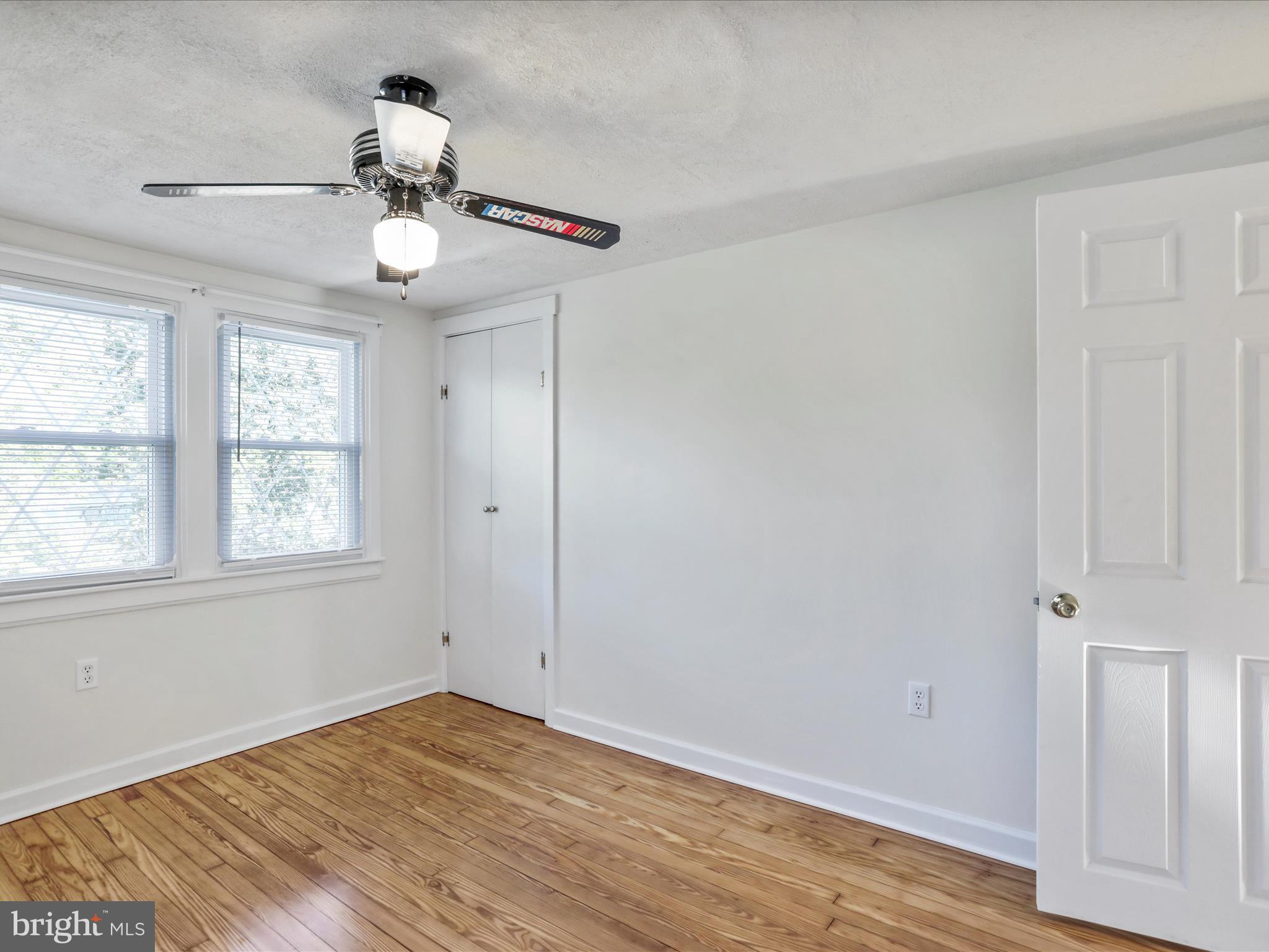 25411 Cascade Road Cascade, MD 21719 - Photo 25 of 53 a view of an empty room with wooden floor and a window