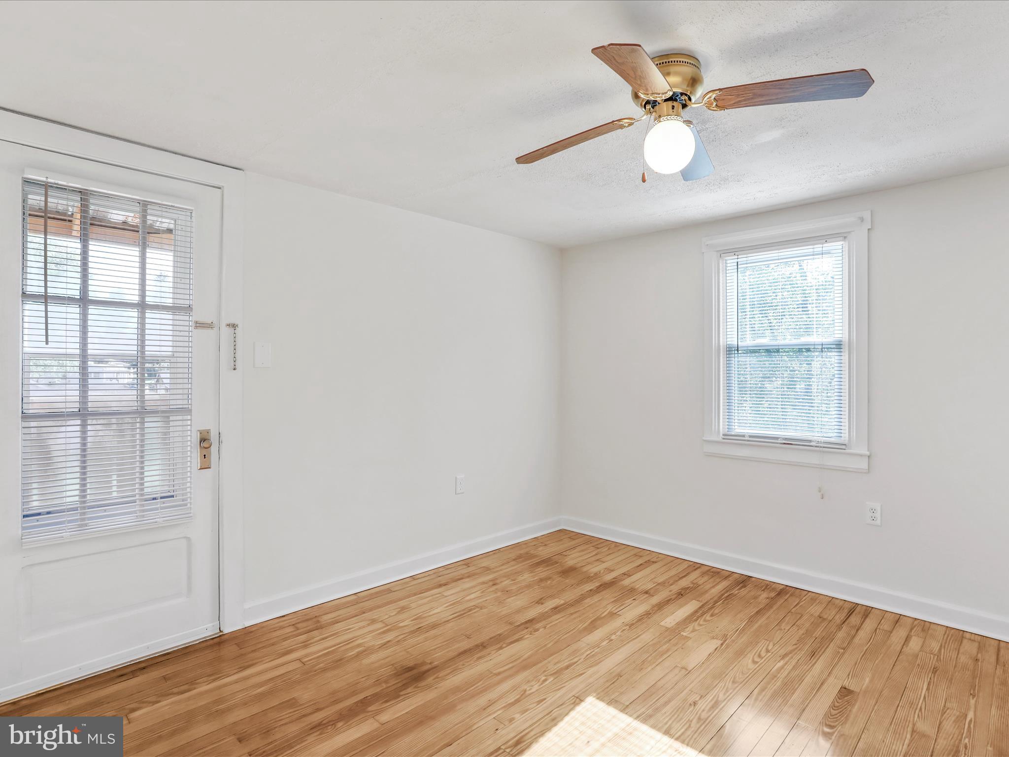25411 Cascade Road Cascade, MD 21719 - Photo 33 of 53 a view of empty room with wooden floor and fan