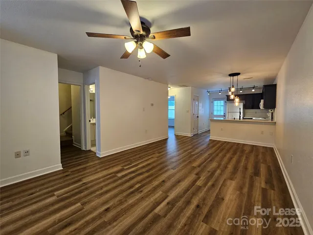 wooden floor in an empty room with a fireplace