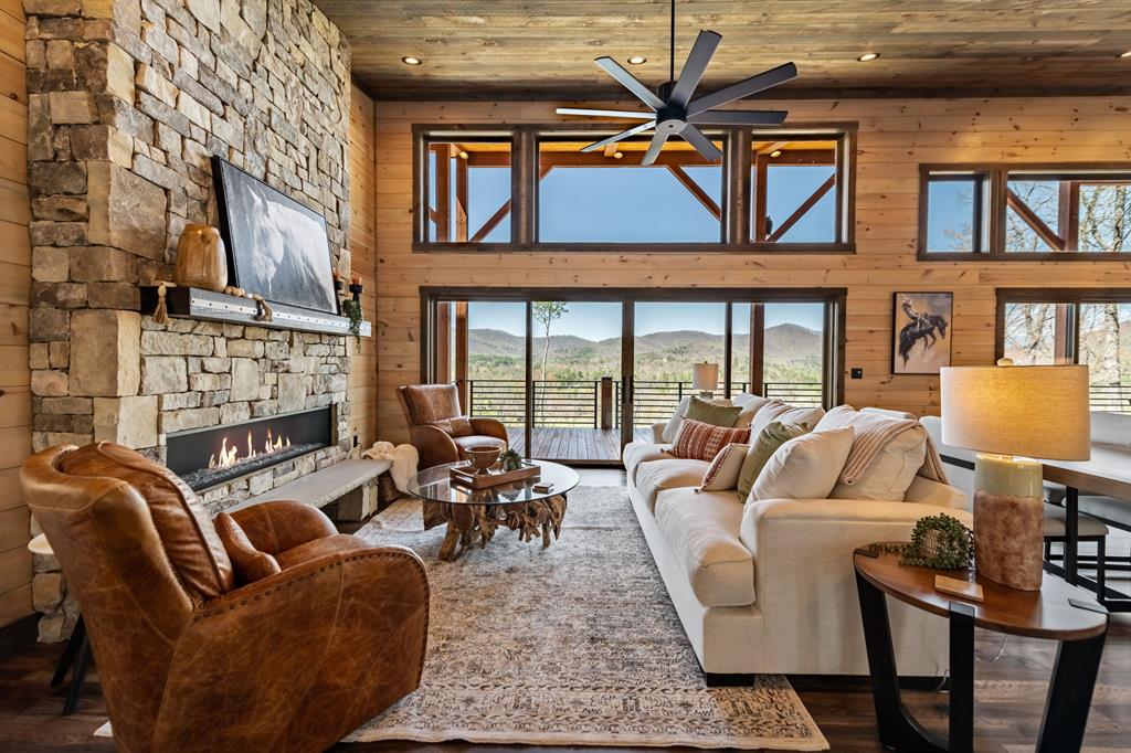 5 High Ridge Road Epworth, GA 30541 - Photo 14 of 27 a living room with furniture a fireplace and a floor to ceiling window