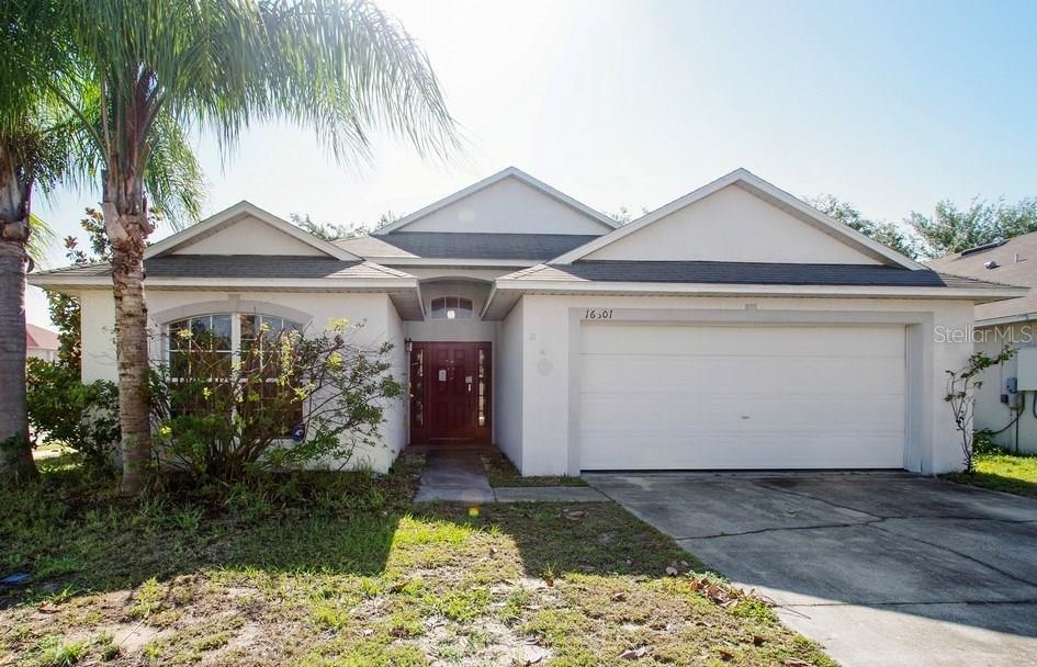 16601 Rising Star Drive Clermont, FL 34714 - Photo 1 of 1 a front view of a house with garden