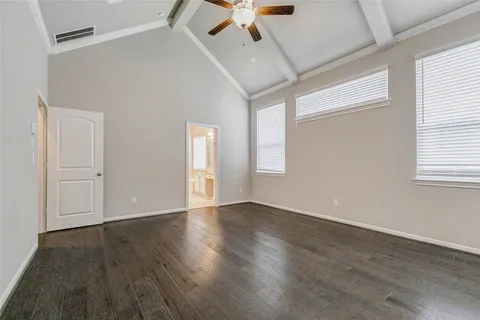a kitchen with a sink dishwasher a stove and a refrigerator with wooden floor