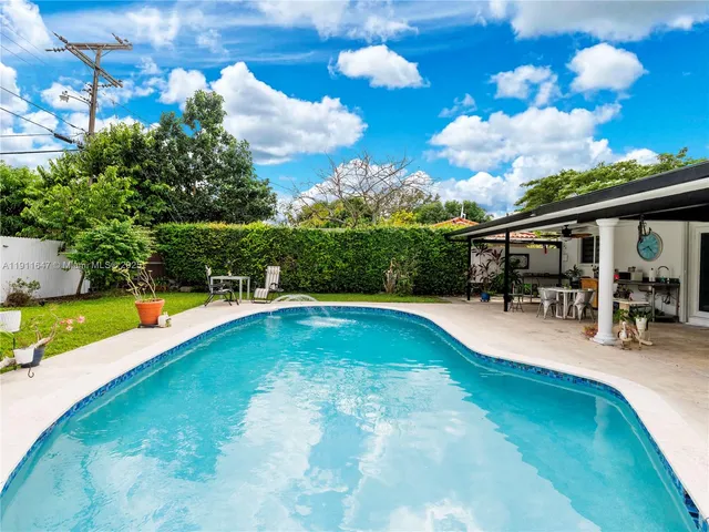 a view of a swimming pool with a patio