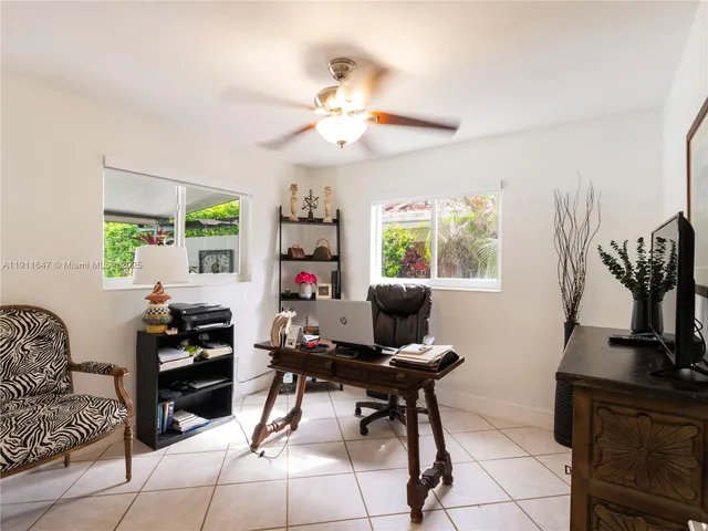 a work room with furniture and a window