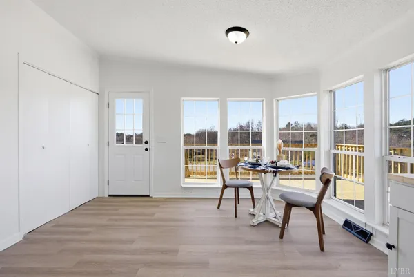 a view of a livingroom with furniture and wooden floor