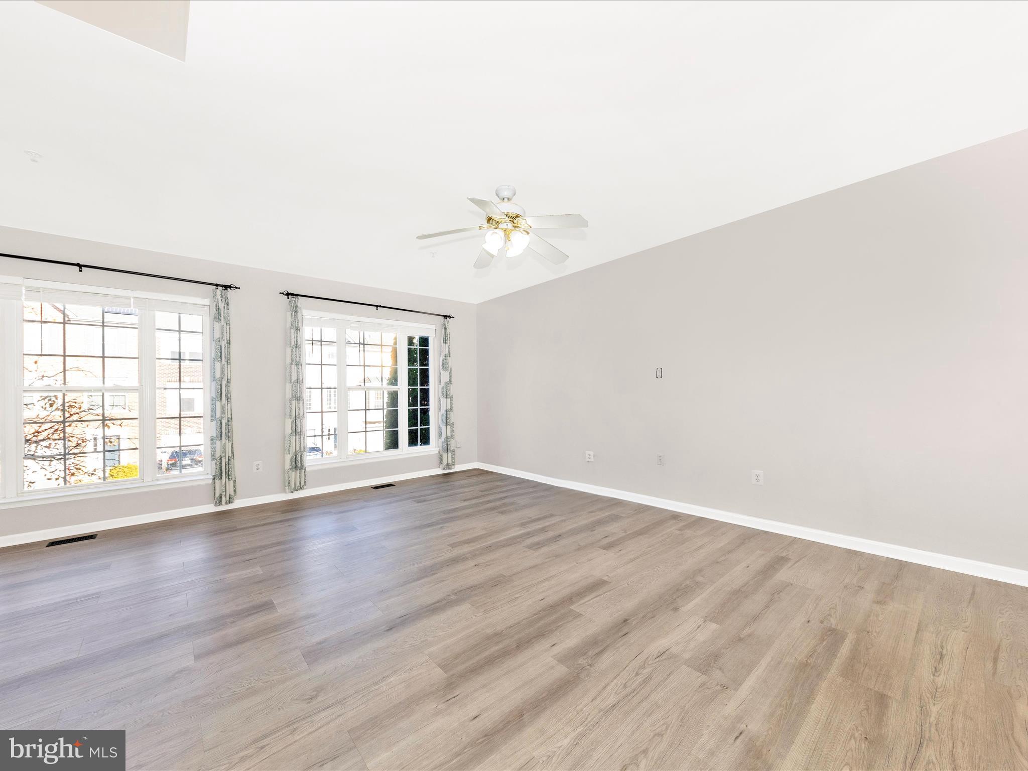 2103 Paxton Terrace Frederick, MD 21702 - Photo 11 of 51 an empty room with wooden floor and window