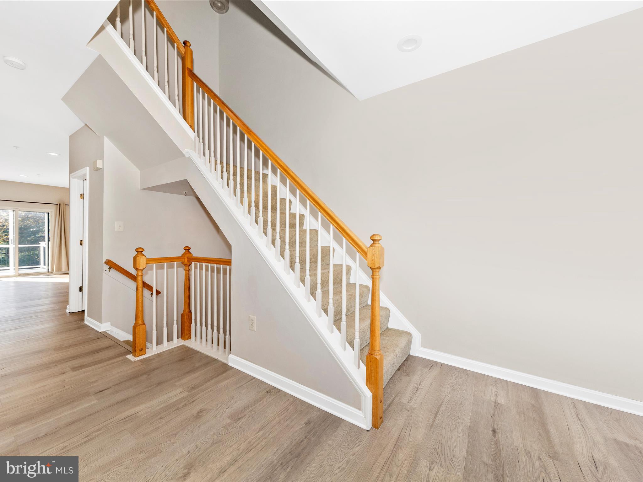 2103 Paxton Terrace Frederick, MD 21702 - Photo 14 of 51 a view of staircase with wooden floor and white walls