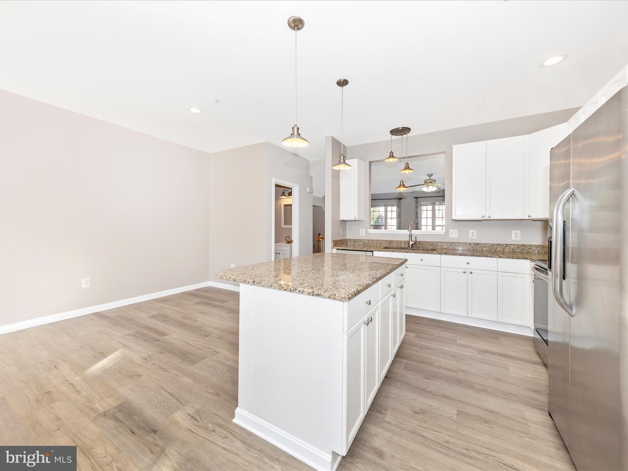 2103 Paxton Terrace Frederick, MD 21702 - Photo 19 of 51 a large kitchen with granite countertop a sink and cabinets
