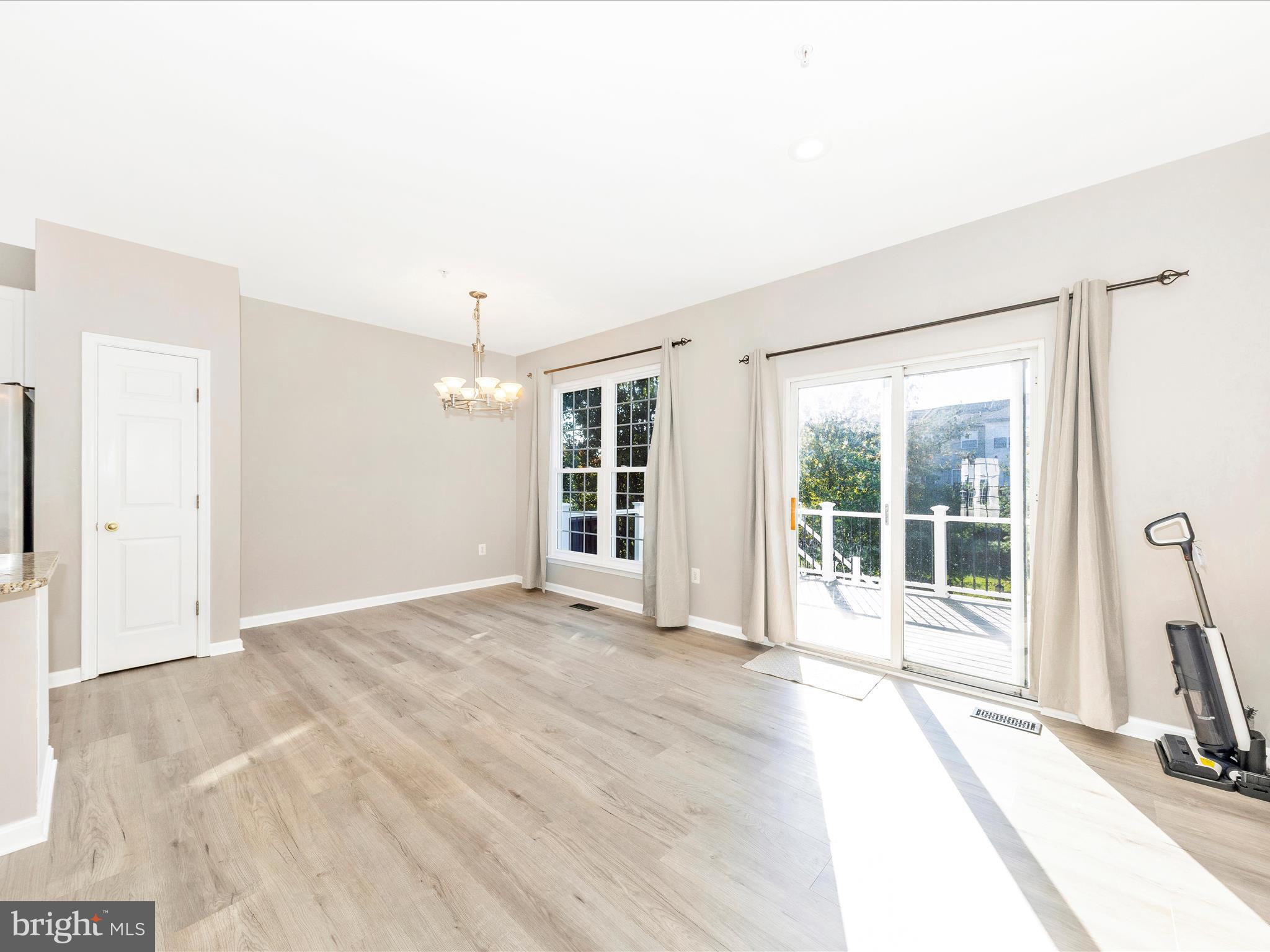 2103 Paxton Terrace Frederick, MD 21702 - Photo 21 of 51 a view of an empty room with glass door and balcony