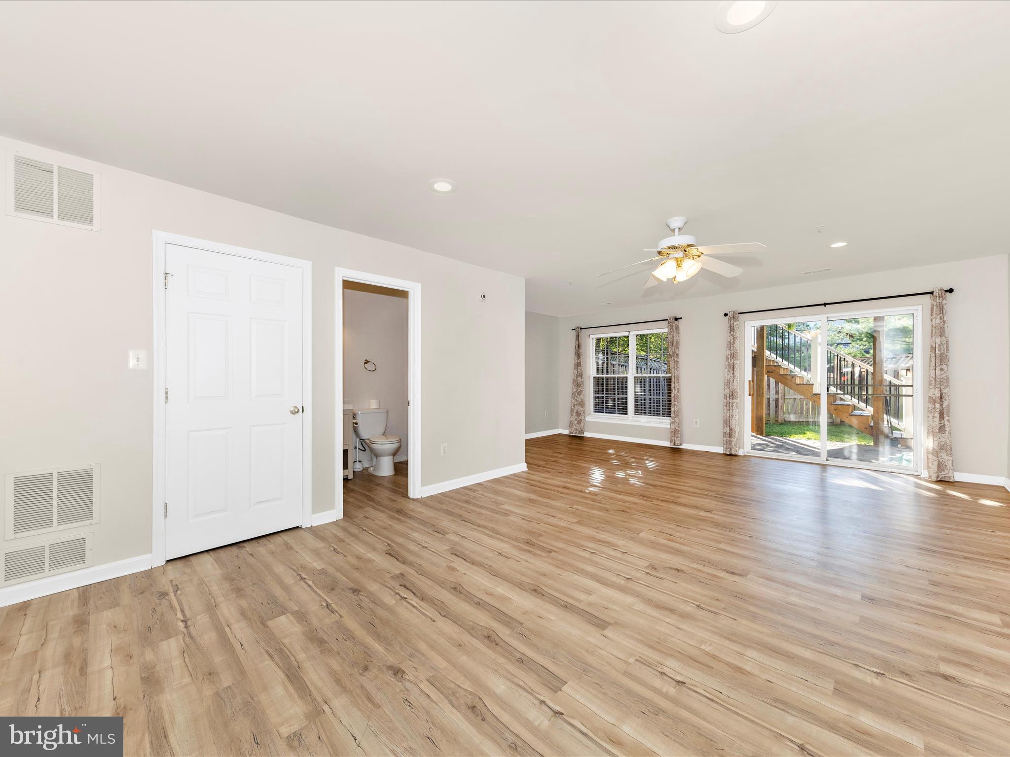 2103 Paxton Terrace Frederick, MD 21702 - Photo 3 of 51 an empty room with wooden floor and windows