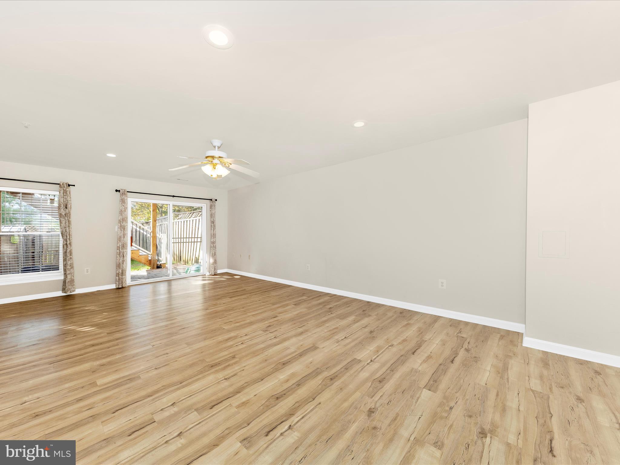 2103 Paxton Terrace Frederick, MD 21702 - Photo 4 of 51 an empty room with wooden floor and window