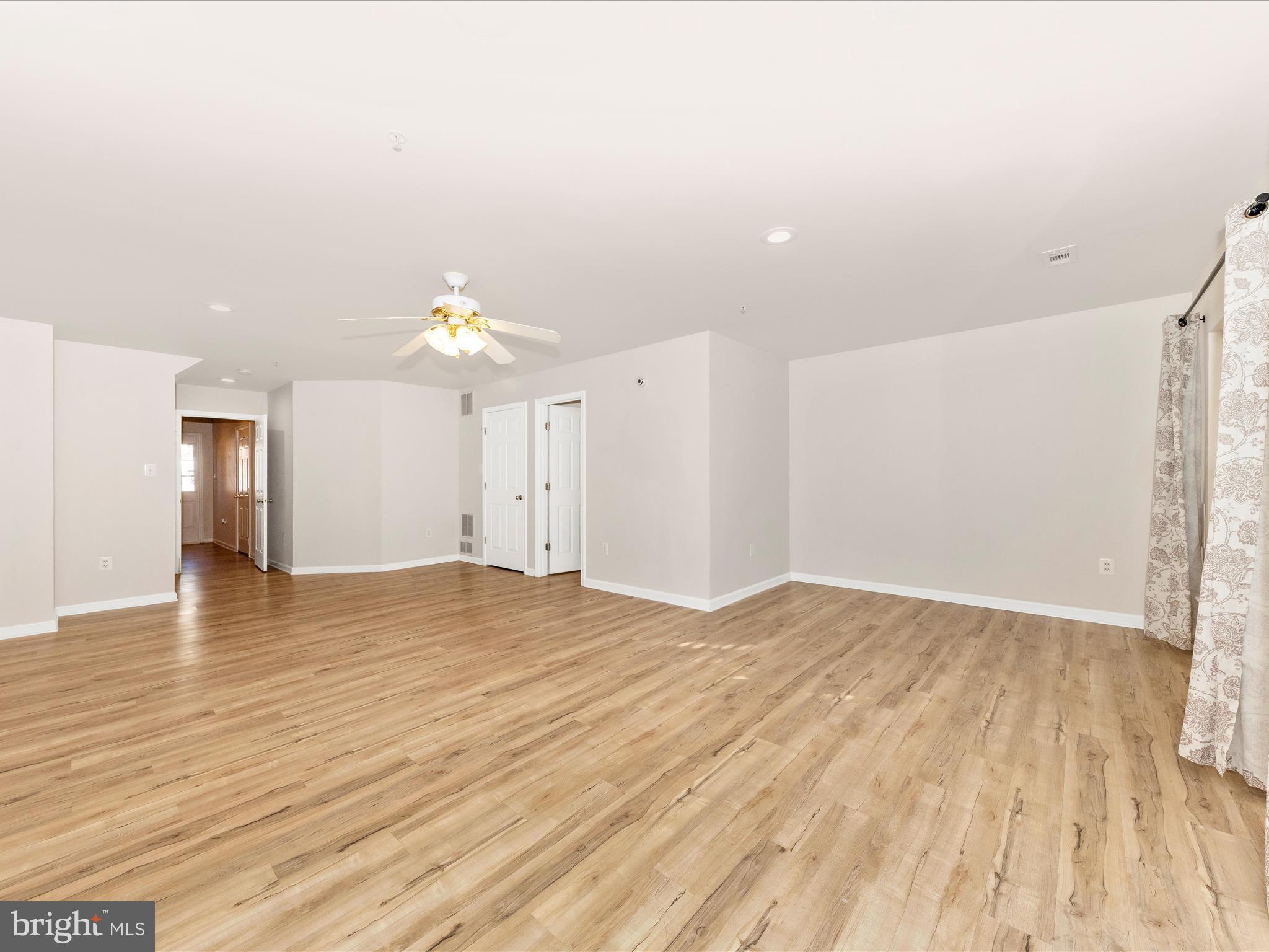 2103 Paxton Terrace Frederick, MD 21702 - Photo 5 of 51 a view of an empty room with wooden floor