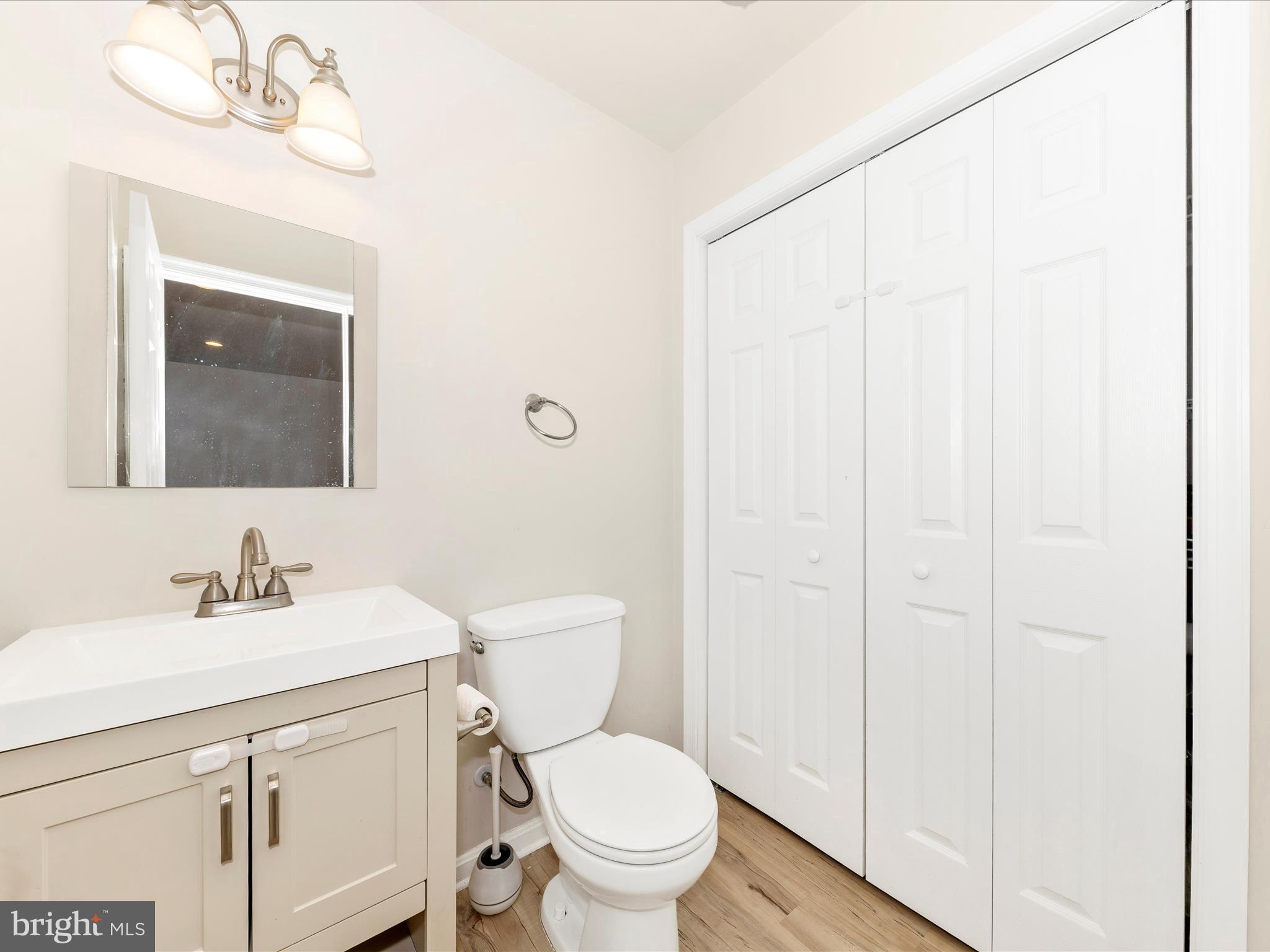 2103 Paxton Terrace Frederick, MD 21702 - Photo 6 of 51 a bathroom with a toilet a sink and a mirror