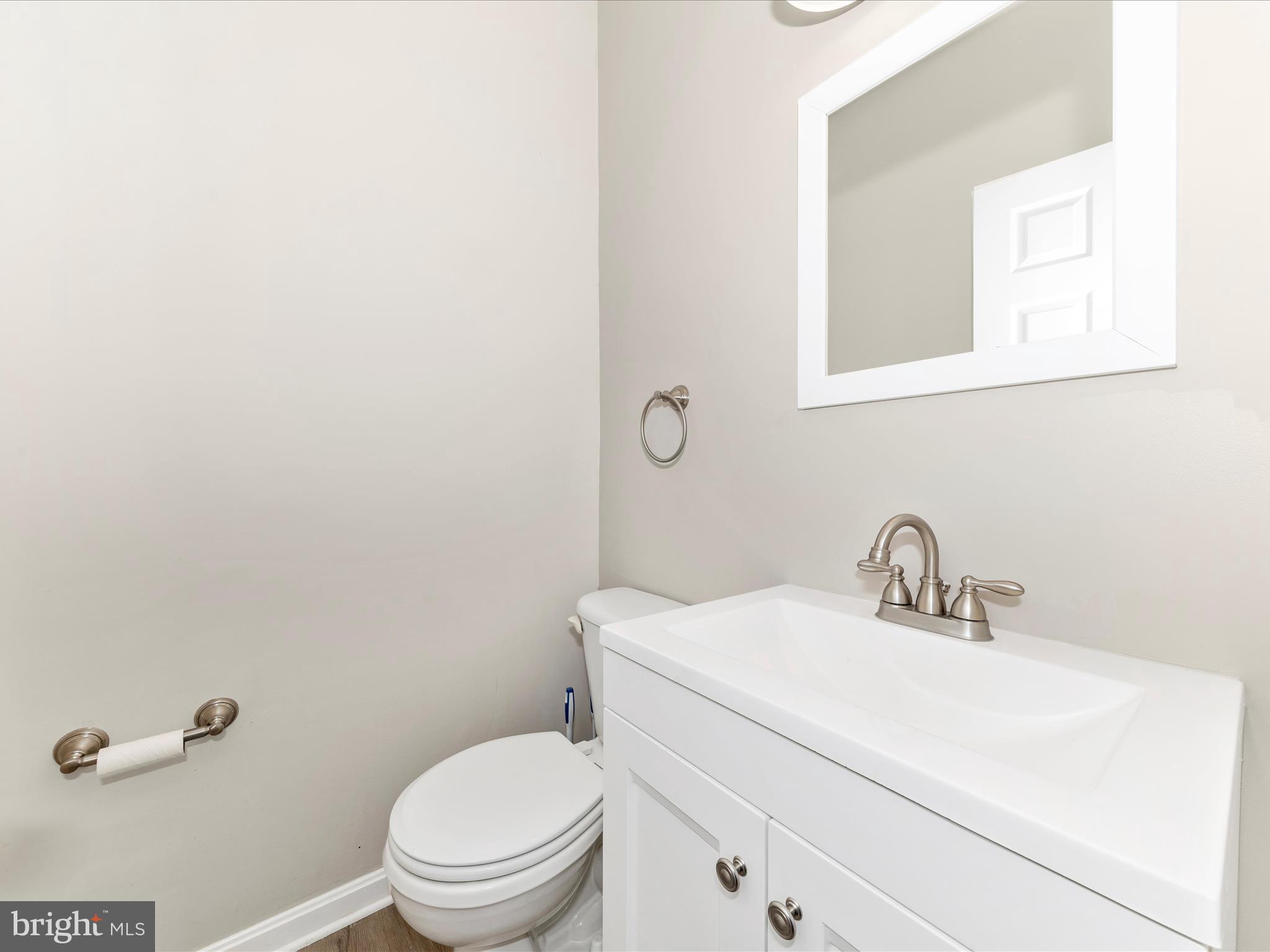 2103 Paxton Terrace Frederick, MD 21702 - Photo 8 of 51 a bathroom with a toilet a sink and mirror