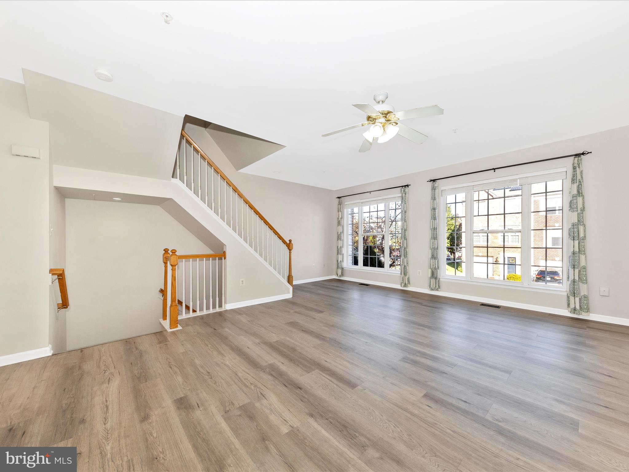 2103 Paxton Terrace Frederick, MD 21702 - Photo 9 of 51 a view of an empty room with wooden floor and a window