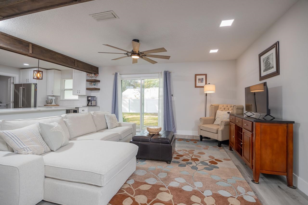 110 Queen Road St. Augustine, FL 32086 - Photo 11 of 37 a living room with furniture and a flat screen tv