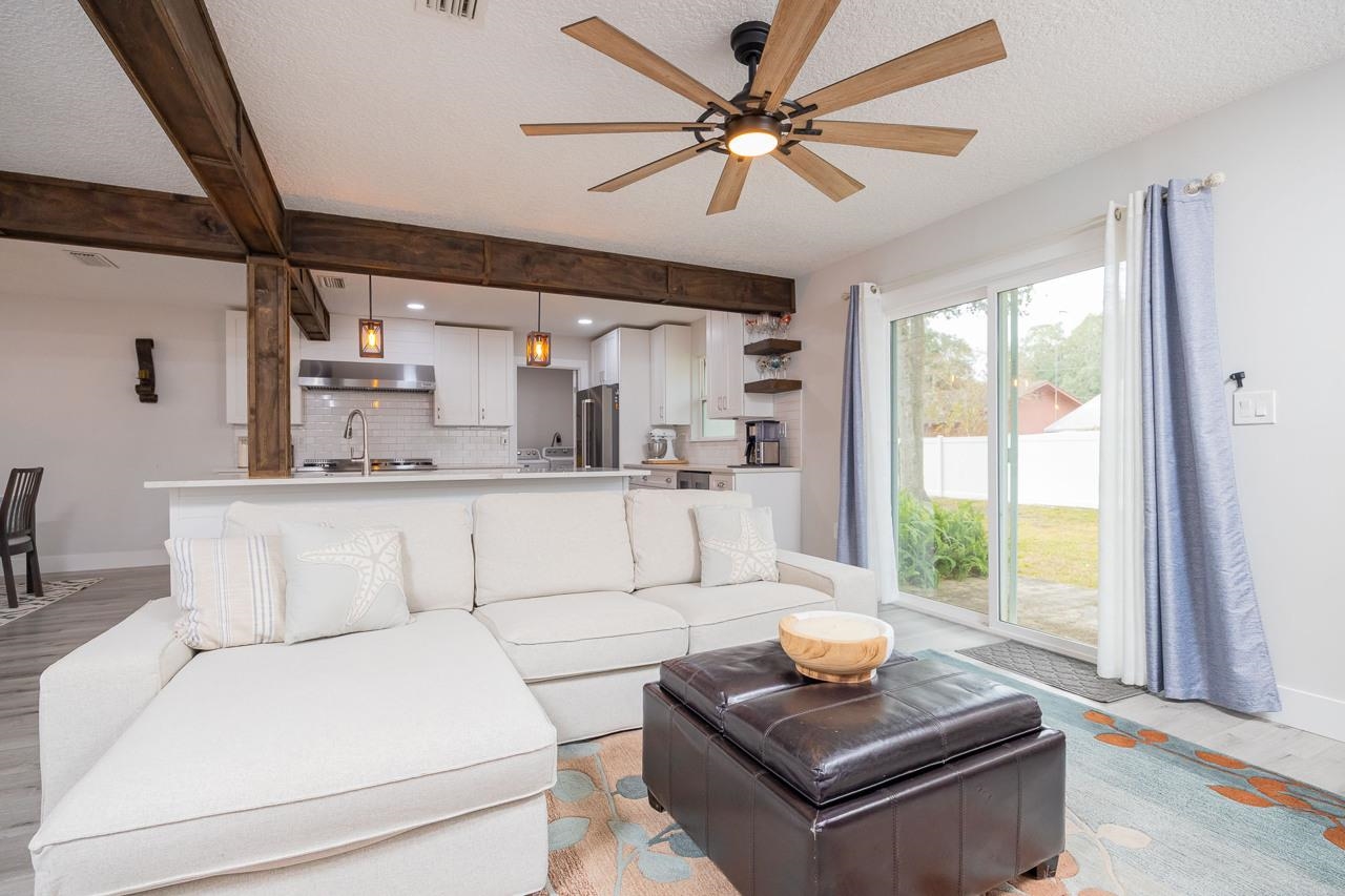110 Queen Road St. Augustine, FL 32086 - Photo 19 of 37 a living room with furniture and a large window