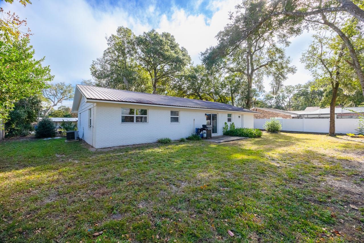 110 Queen Road St. Augustine, FL 32086 - Photo 20 of 37 a view of a house with backyard and garden