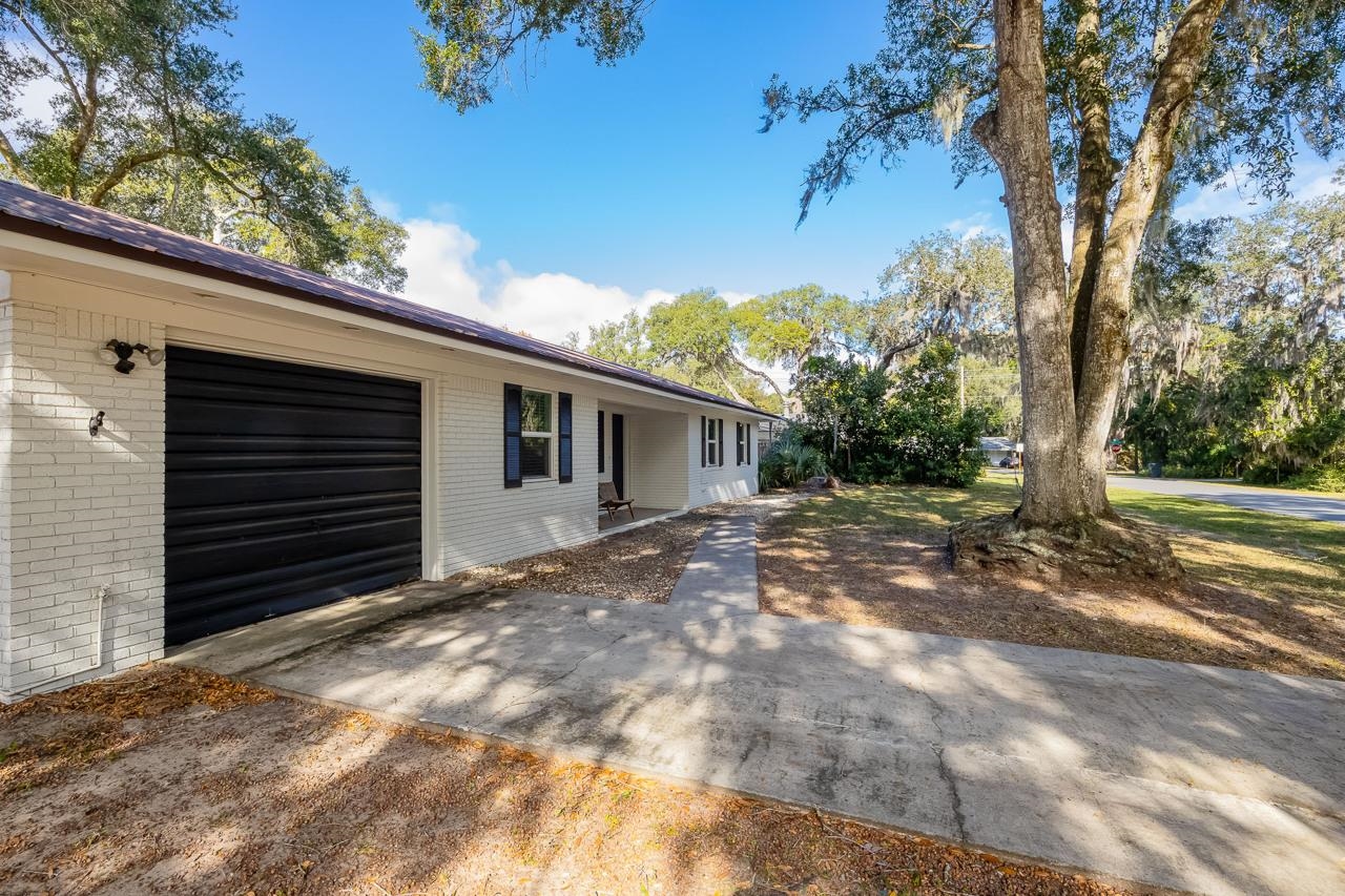 110 Queen Road St. Augustine, FL 32086 - Photo 2 of 37 a view of a house with a yard
