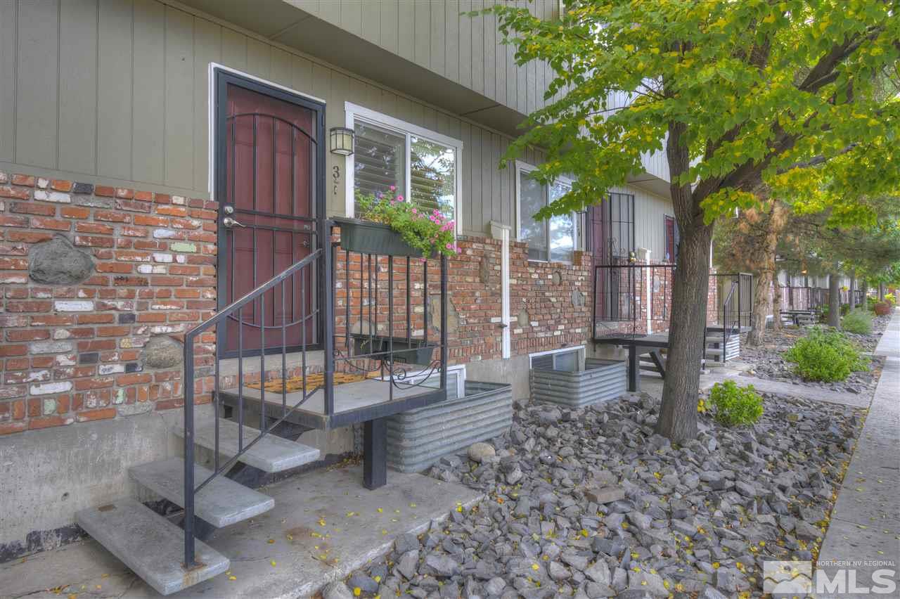1408 East 9th Street Reno, NV 89512 - Photo 1 of 25 a view of a porch with chairs and potted plants