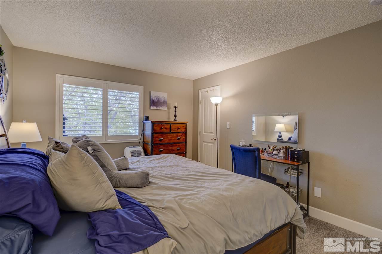 1408 East 9th Street Reno, NV 89512 - Photo 11 of 25 a bedroom with a bed and furniture