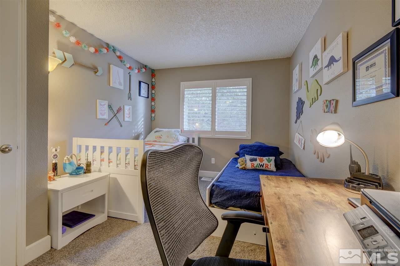 1408 East 9th Street Reno, NV 89512 - Photo 14 of 25 a room with furniture and a window