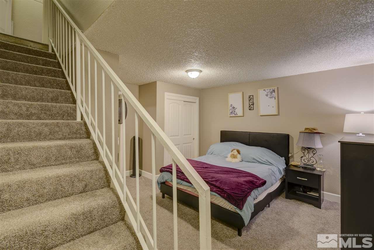 1408 East 9th Street Reno, NV 89512 - Photo 16 of 25 a bedroom with a bed and a view of entryway