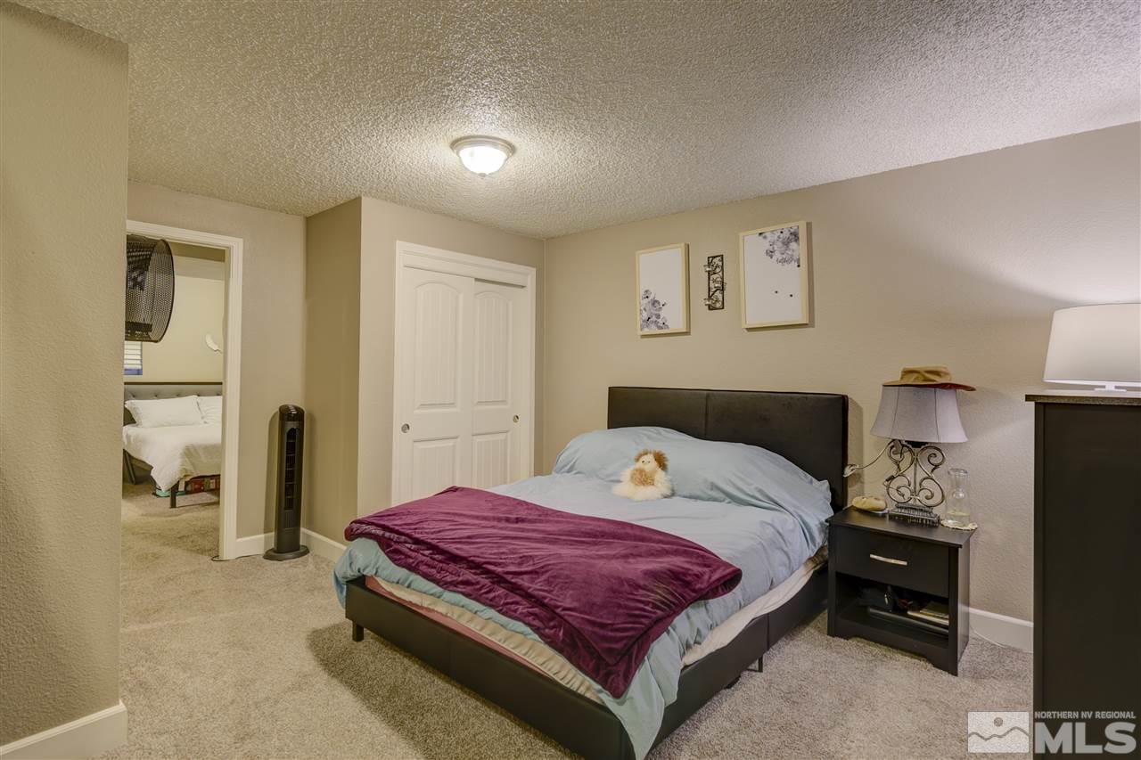 1408 East 9th Street Reno, NV 89512 - Photo 17 of 25 a bedroom with a bed and a view of kitchen