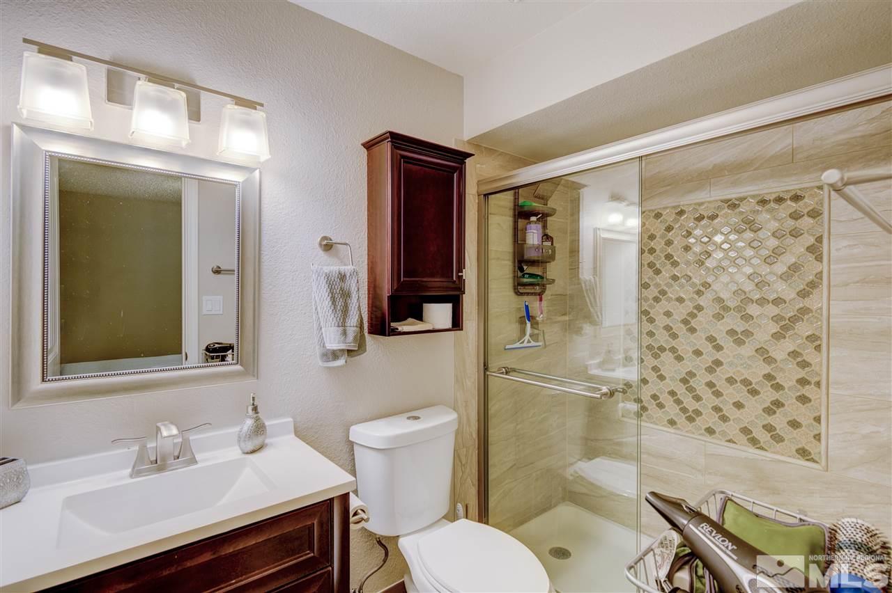 1408 East 9th Street Reno, NV 89512 - Photo 19 of 25 a bathroom with a sink toilet and shower