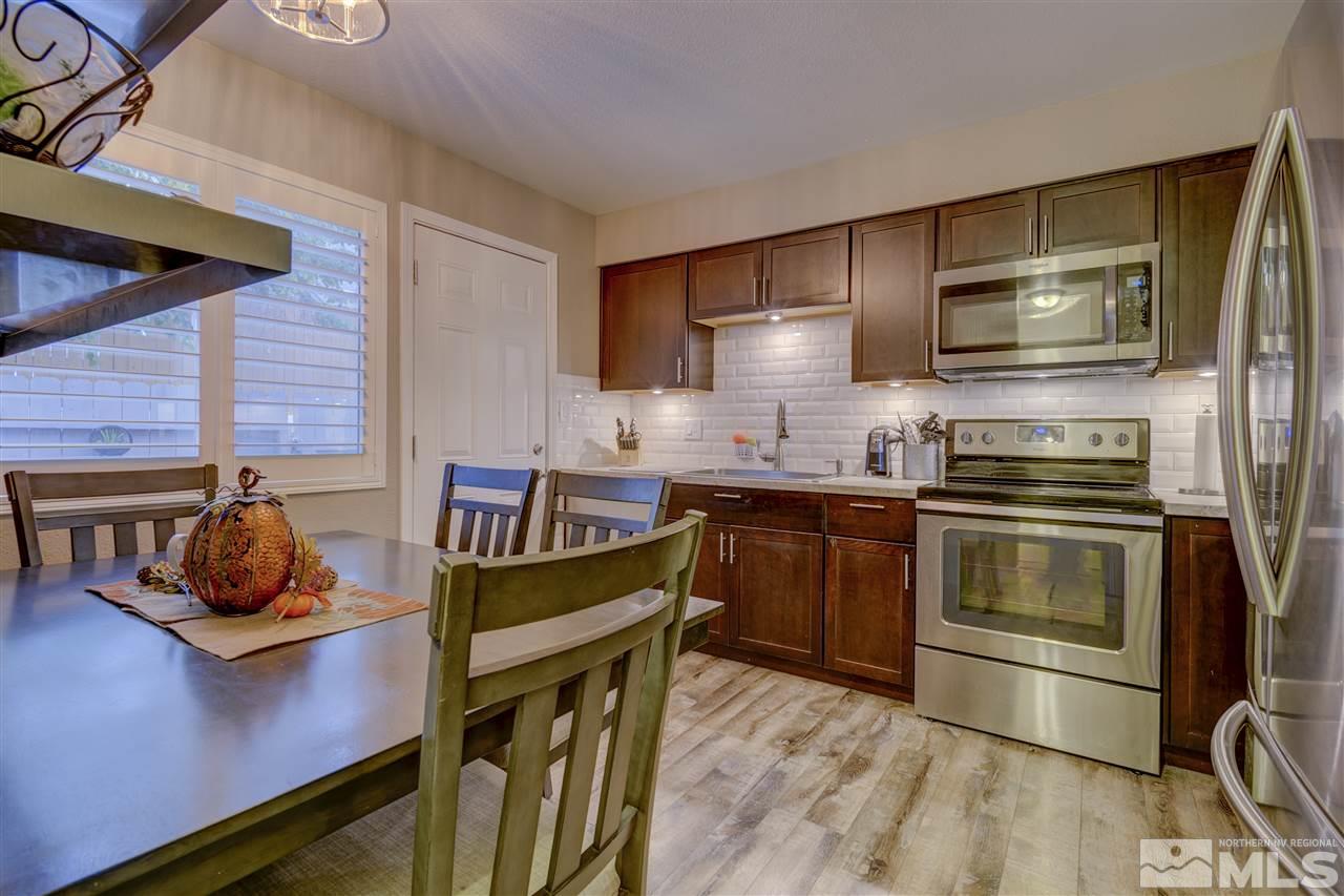 1408 East 9th Street Reno, NV 89512 - Photo 2 of 25 a kitchen with a stove and a refrigerator