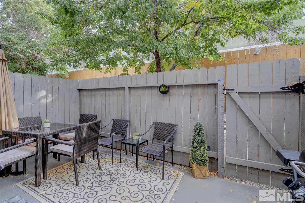 1408 East 9th Street Reno, NV 89512 - Photo 24 of 25 a backyard of a house with table and chairs