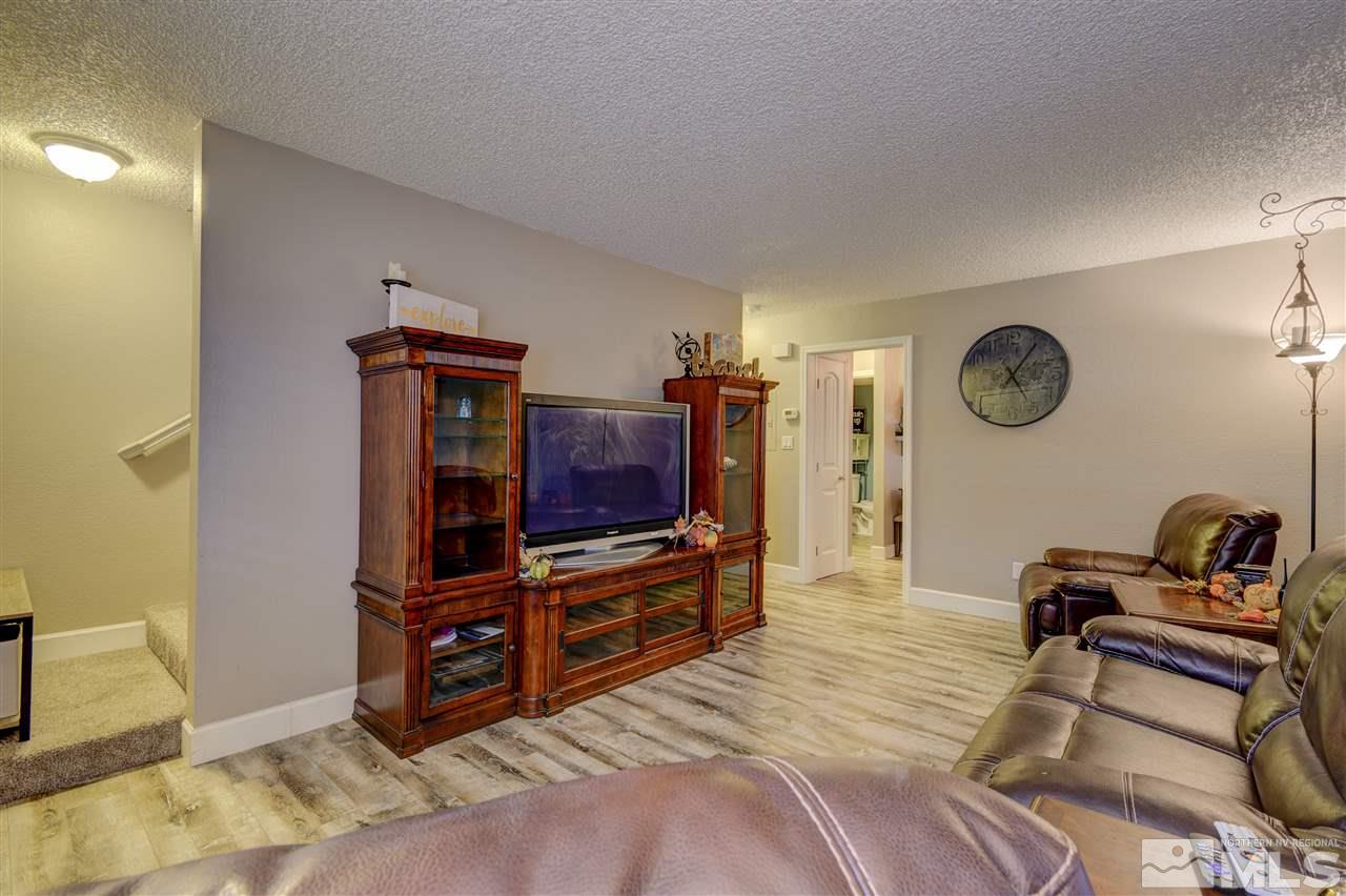 1408 East 9th Street Reno, NV 89512 - Photo 7 of 25 a bedroom with furniture and a flat screen tv