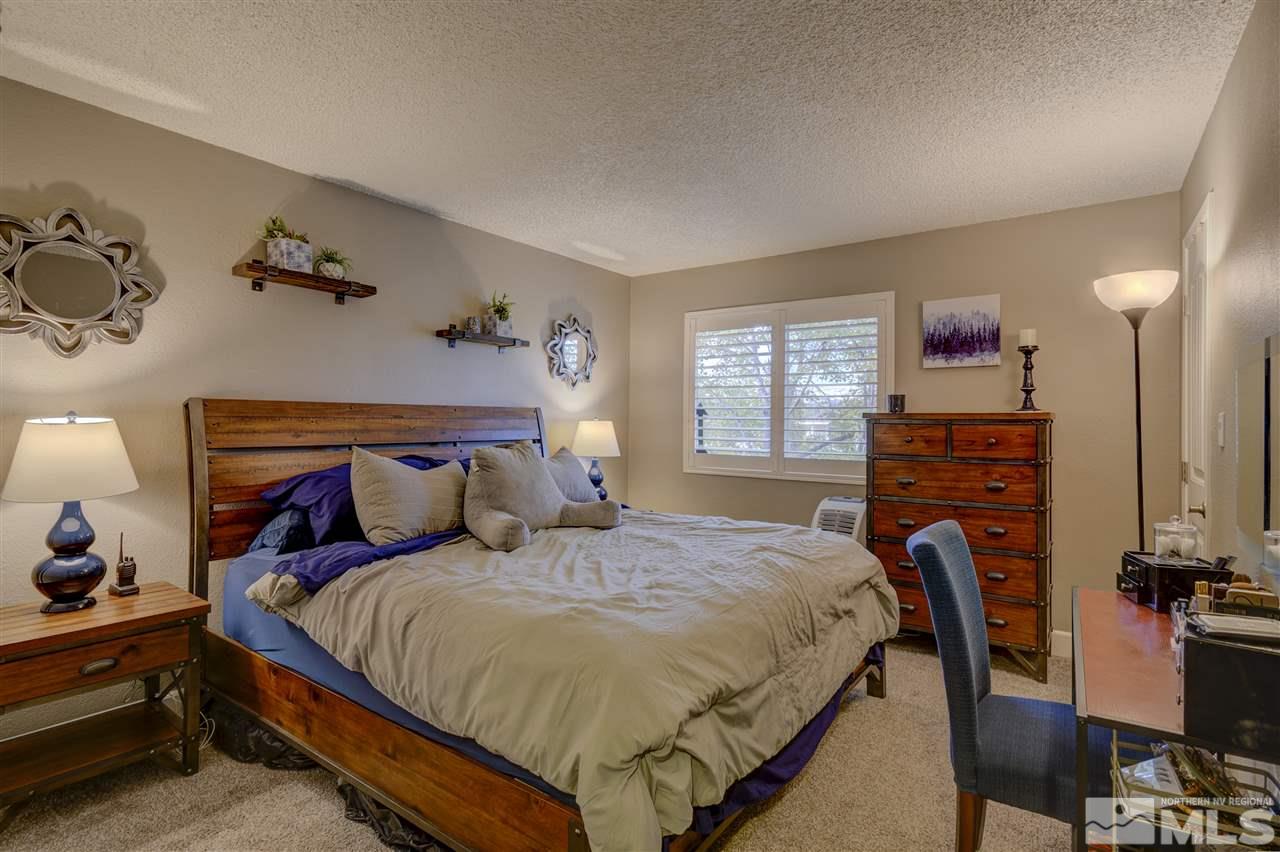 1408 East 9th Street Reno, NV 89512 - Photo 10 of 25 a bed room with a bed and a tv