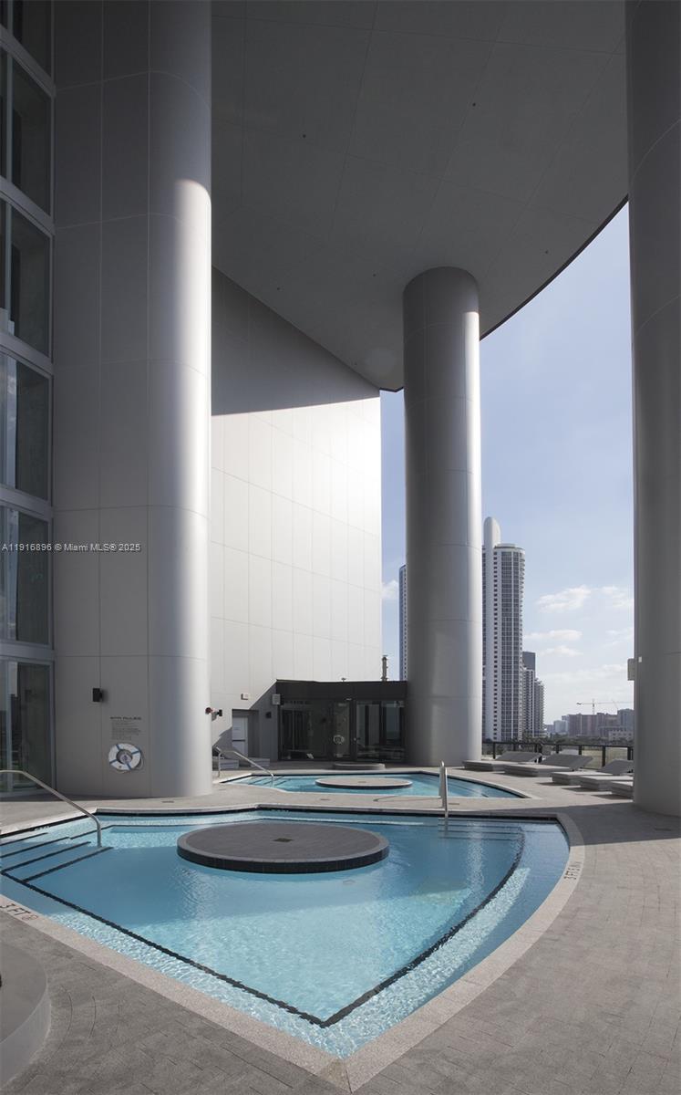 18555 Collins Avenue, Unit 3505 Sunny Isles Beach, FL 33160 - Photo 49 of 52 a view of a living room with furniture