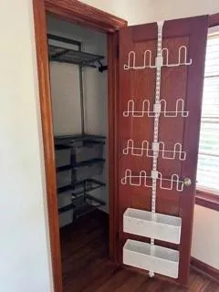 a view of an entryway with wooden floor