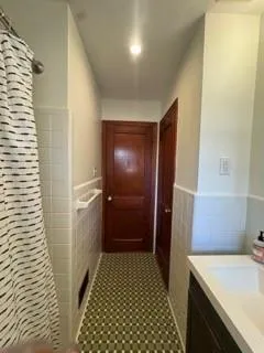 a bathroom with a sink and a shower