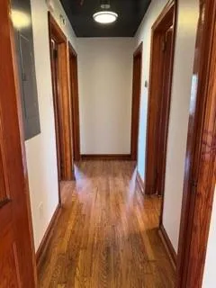 a view of front door with wooden floor