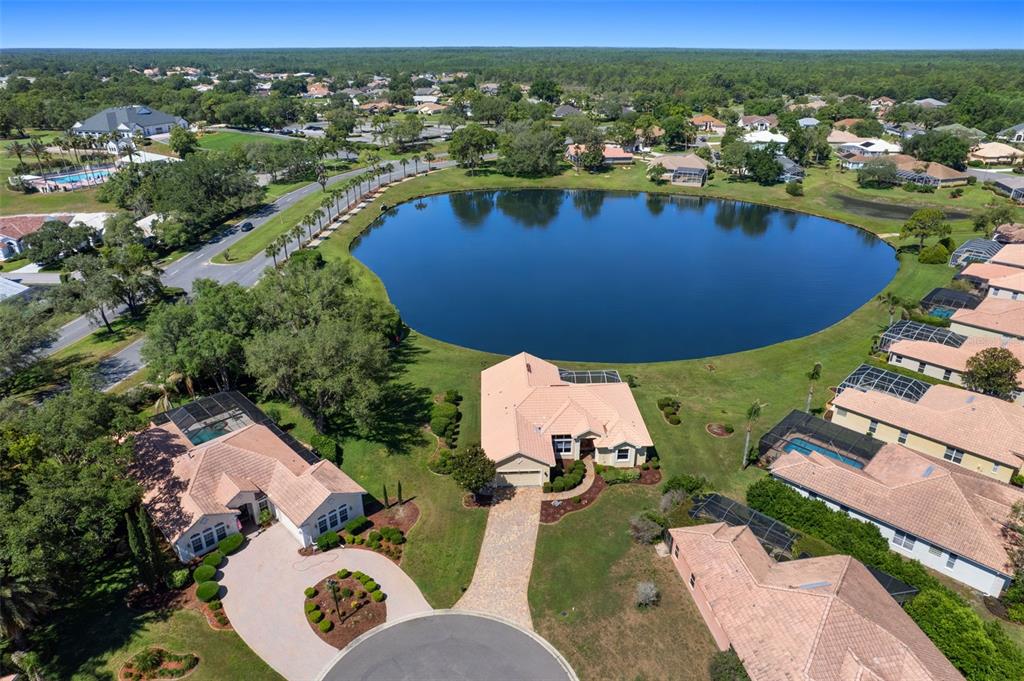 10081 Georgetown Court Weeki Wachee, FL 34613 - Photo 68 of 76 an aerial view of a house with a swimming pool yard and outdoor seating