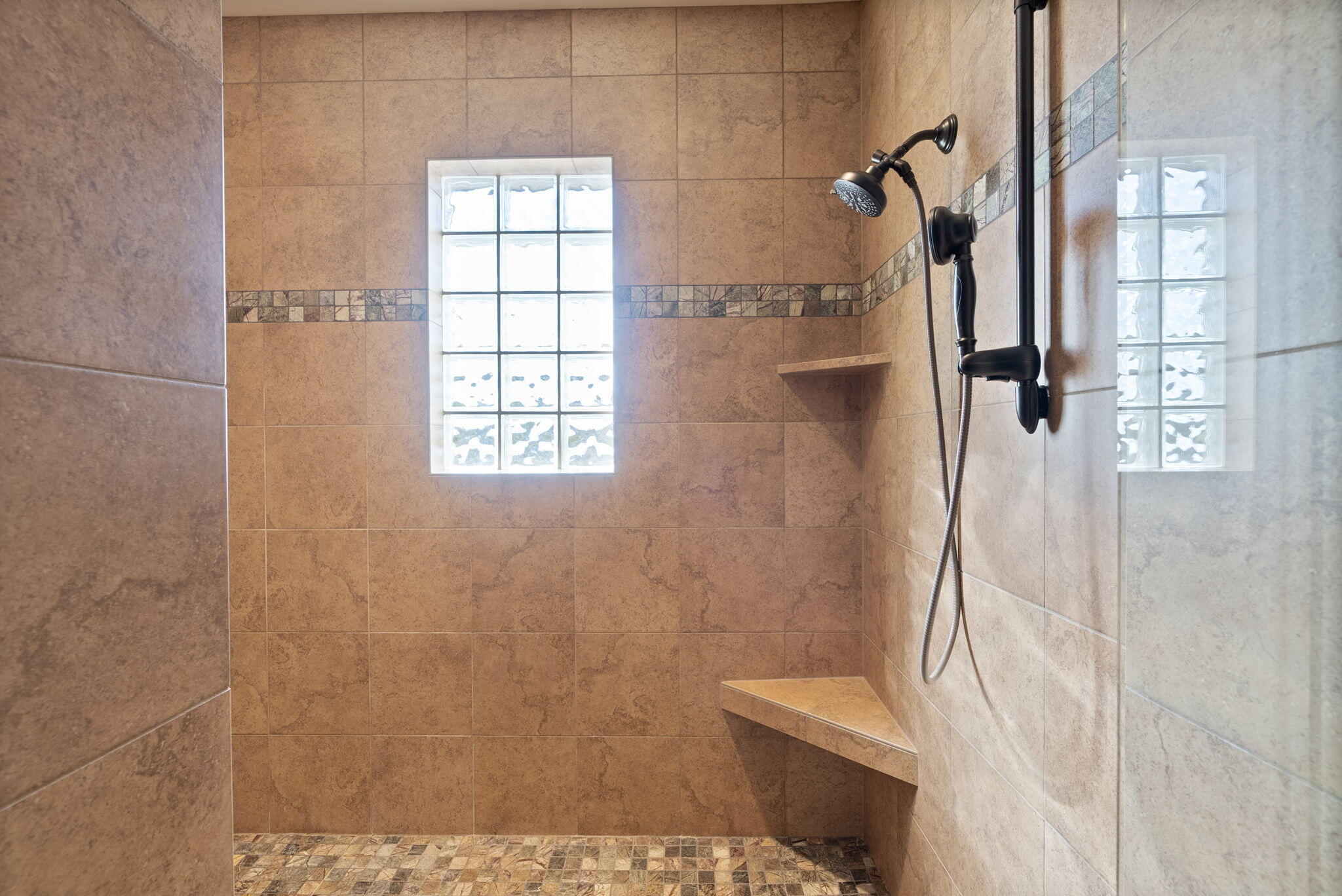 22887 Ghost Tree Lane Bend, OR 97701 - Photo 51 of 97 Fully tiled walk-in shower with custom glass door and multipe shower heads