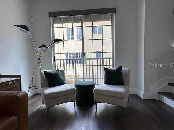 a living room with furniture and a large window