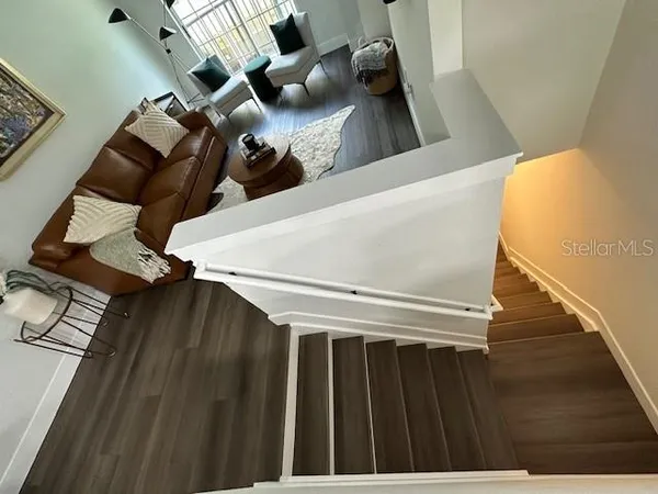 a view of staircase with rug