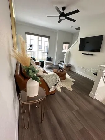 a living room with furniture and a flat screen tv