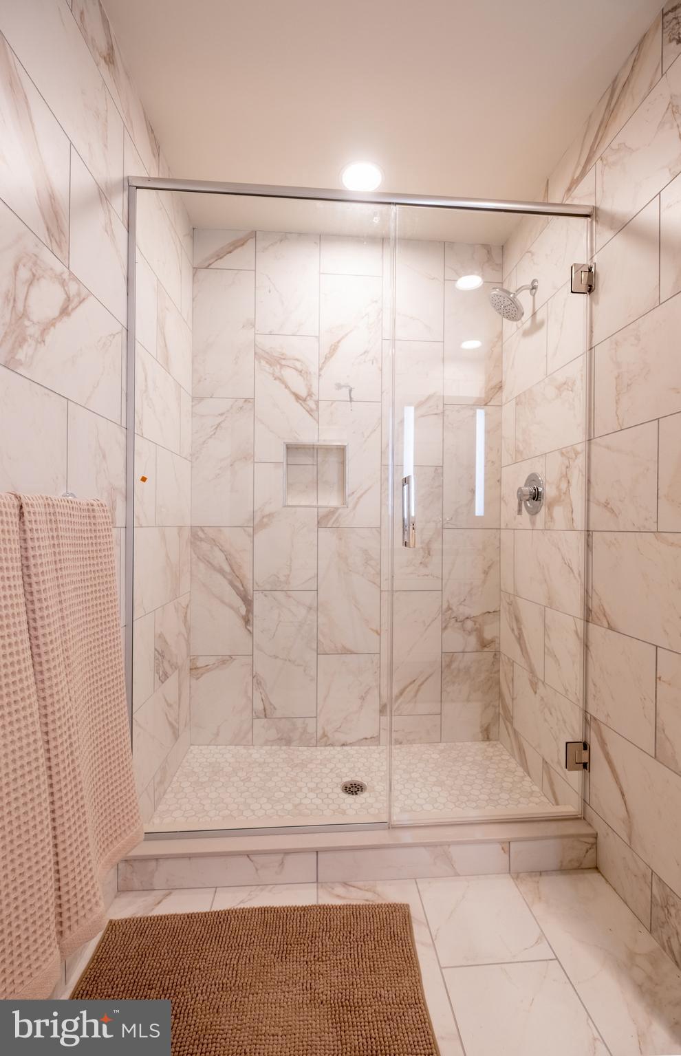 2301-61 John F Kennedy Boulevard, Unit 208 Philadelphia, PA 19103 - Photo 12 of 36 a bathroom with a shower