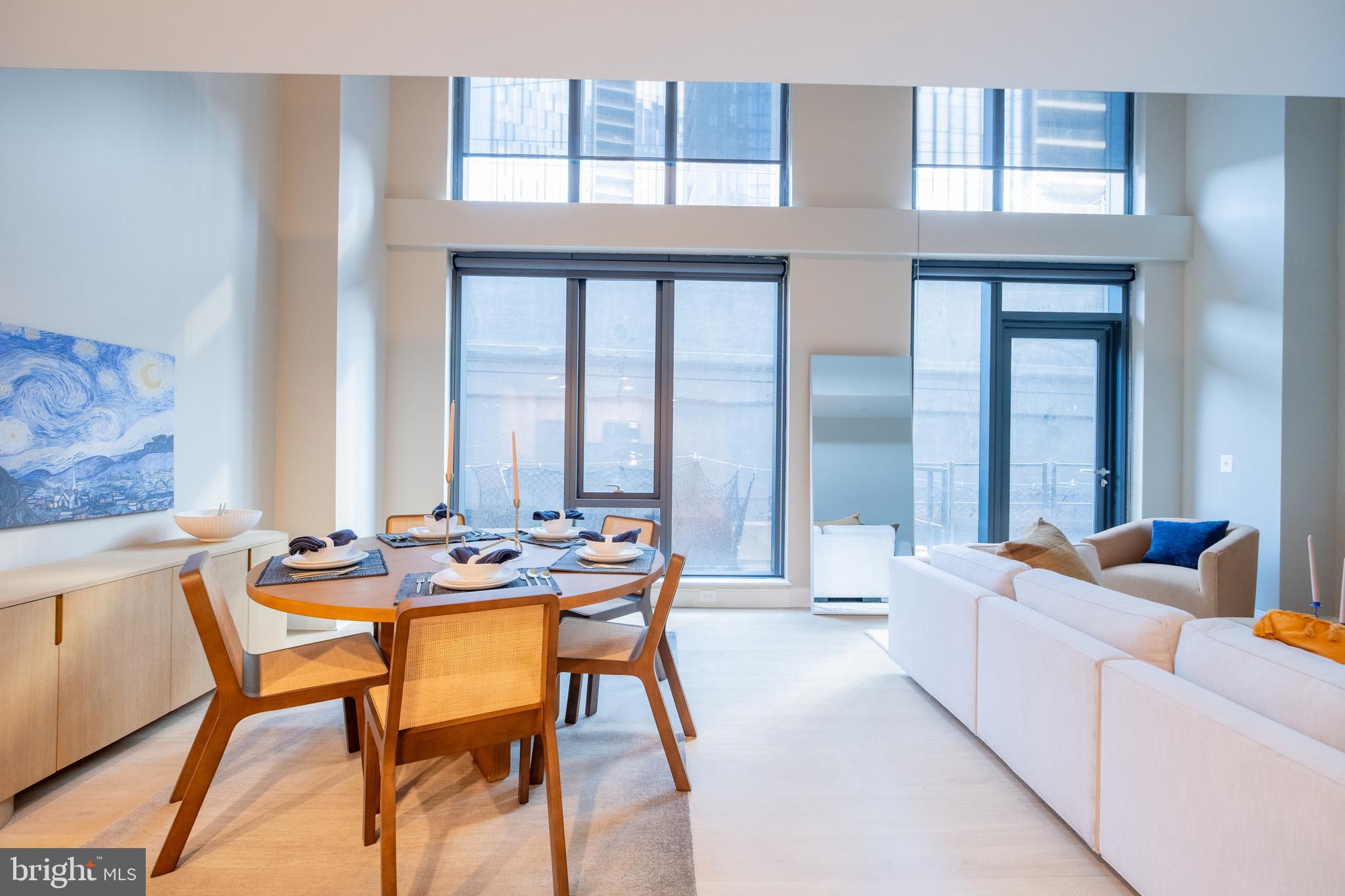 2301-61 John F Kennedy Boulevard, Unit 208 Philadelphia, PA 19103 - Photo 31 of 36 a living room with furniture and large windows