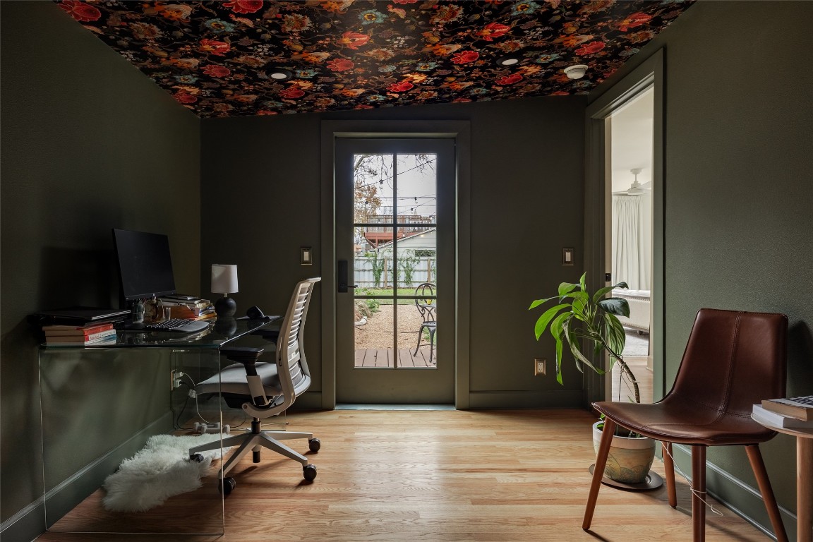 2613 East 2nd Street Austin, TX 78702 - Photo 14 of 30 a view of a workspace with furniture and a potted plant