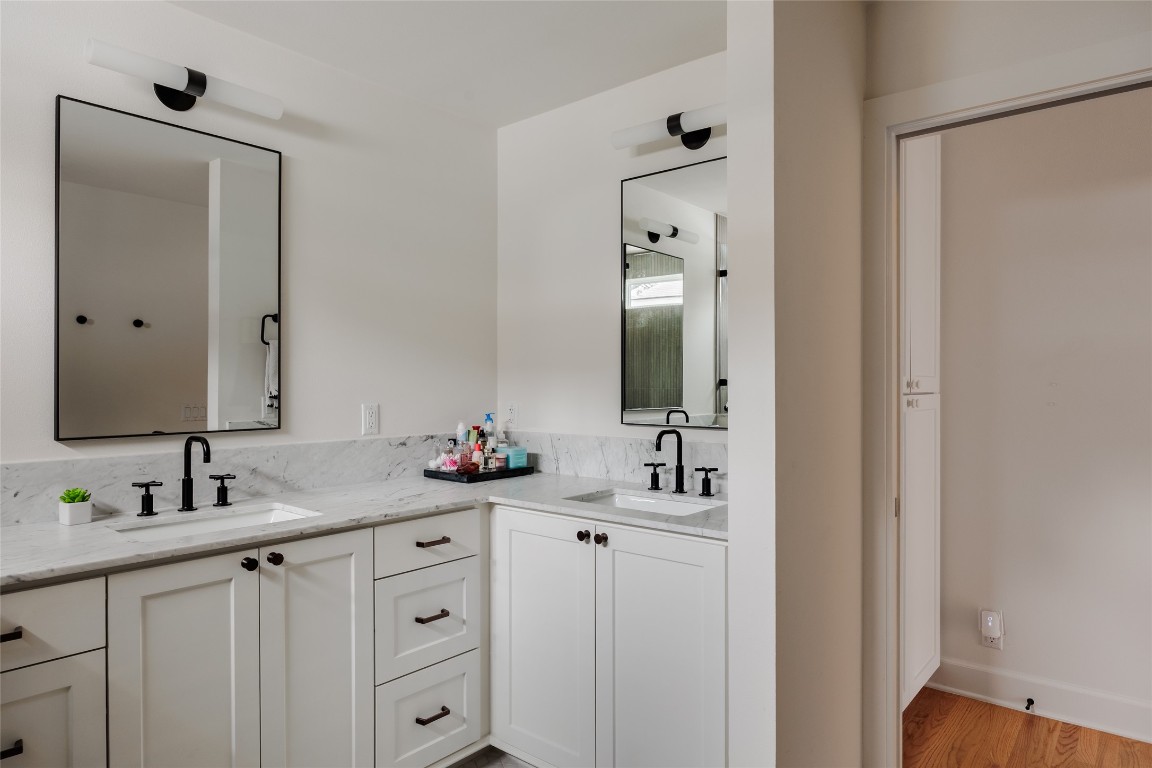 2613 East 2nd Street Austin, TX 78702 - Photo 20 of 30 a bathroom with double sink and a mirror