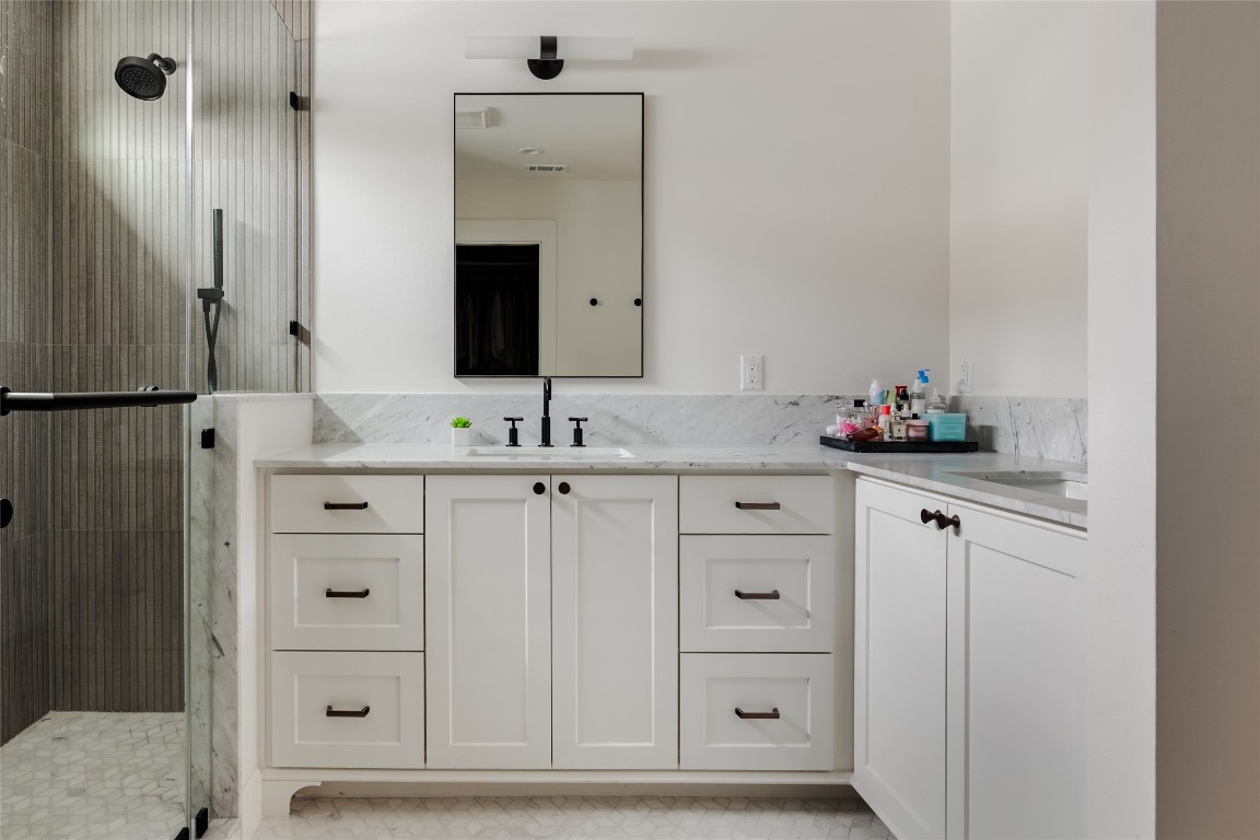 2613 East 2nd Street Austin, TX 78702 - Photo 21 of 30 a bathroom with a sink vanity and mirror